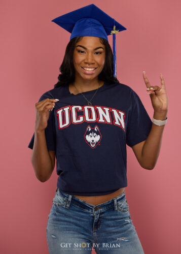 Senior Pictures with cap and UCONN shirt